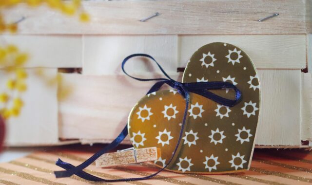 decorative heart, gift tag, rustic decor, wooden crate, handmade, romantic detail, craft design, valentine gift, sunflower pattern, love decoration, heart shape, ribbon bow, packaging design, cozy style, boho decor, romantic symbol, wedding decor, heart ornament, diy decor, artisan detail, small gift, celebration, floral pattern, love tag, wooden background